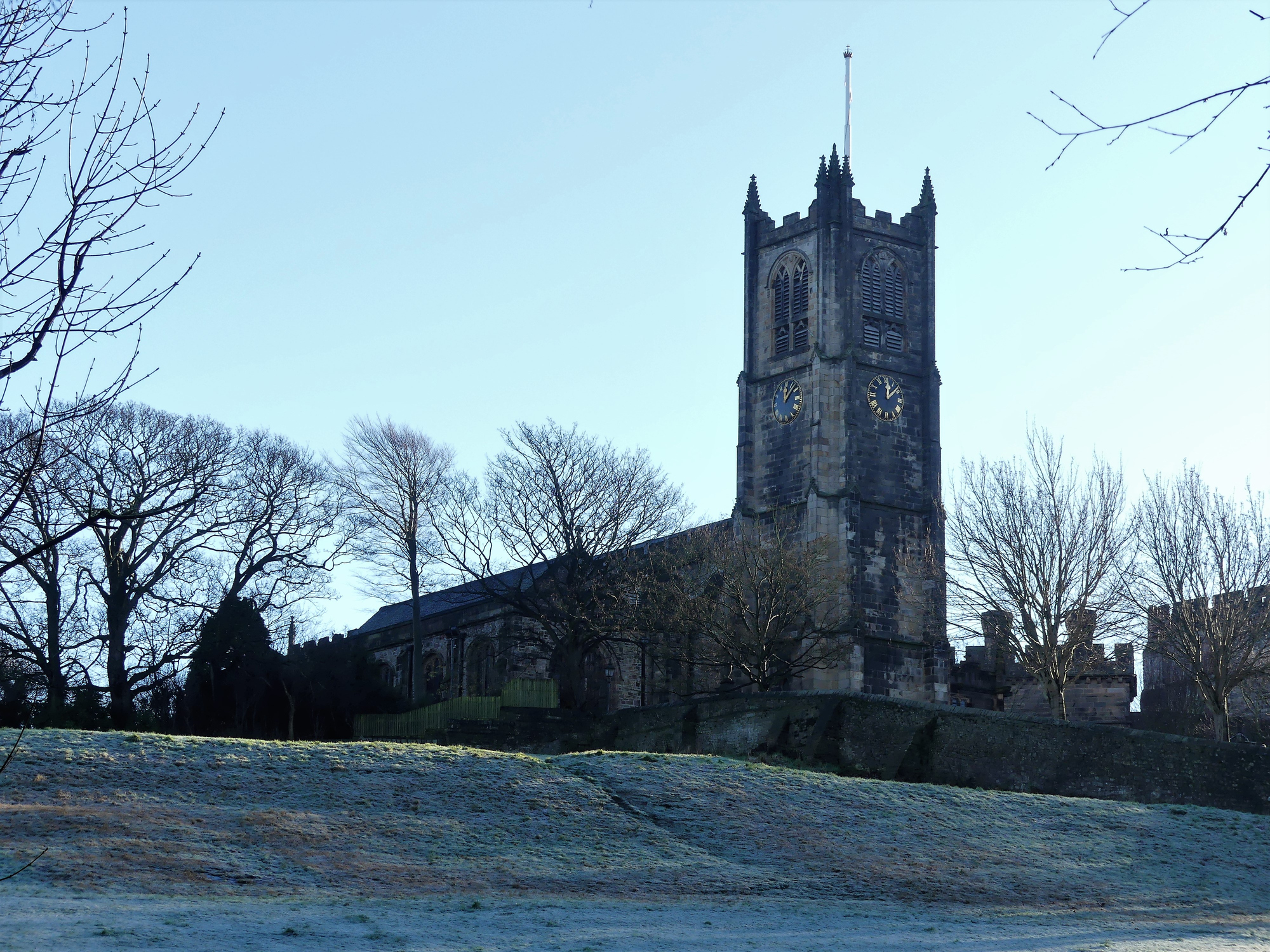 Lancaster, Lancashire, UK - December 24th 2018: Lancaster Priory church viewed from across Vicarage Field, Lancashire
